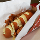 Illustration for article titled KFCs Double Down hot dog is a sausage wrapped in a fried chicken bun